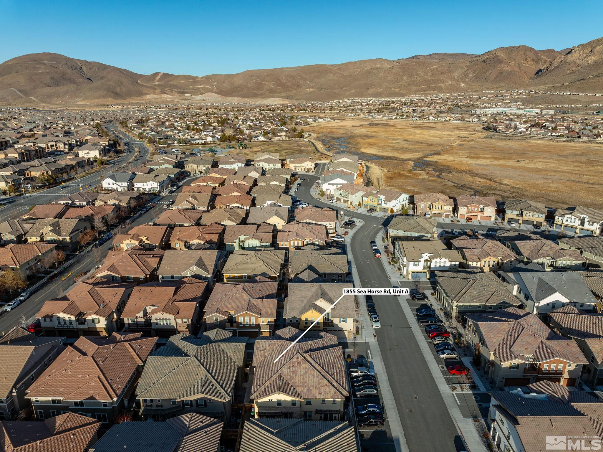1855 Sea Horse Road, Unit A Reno, NV 89521 - Photo 27 of 32 an aerial view of residential houses with outdoor space