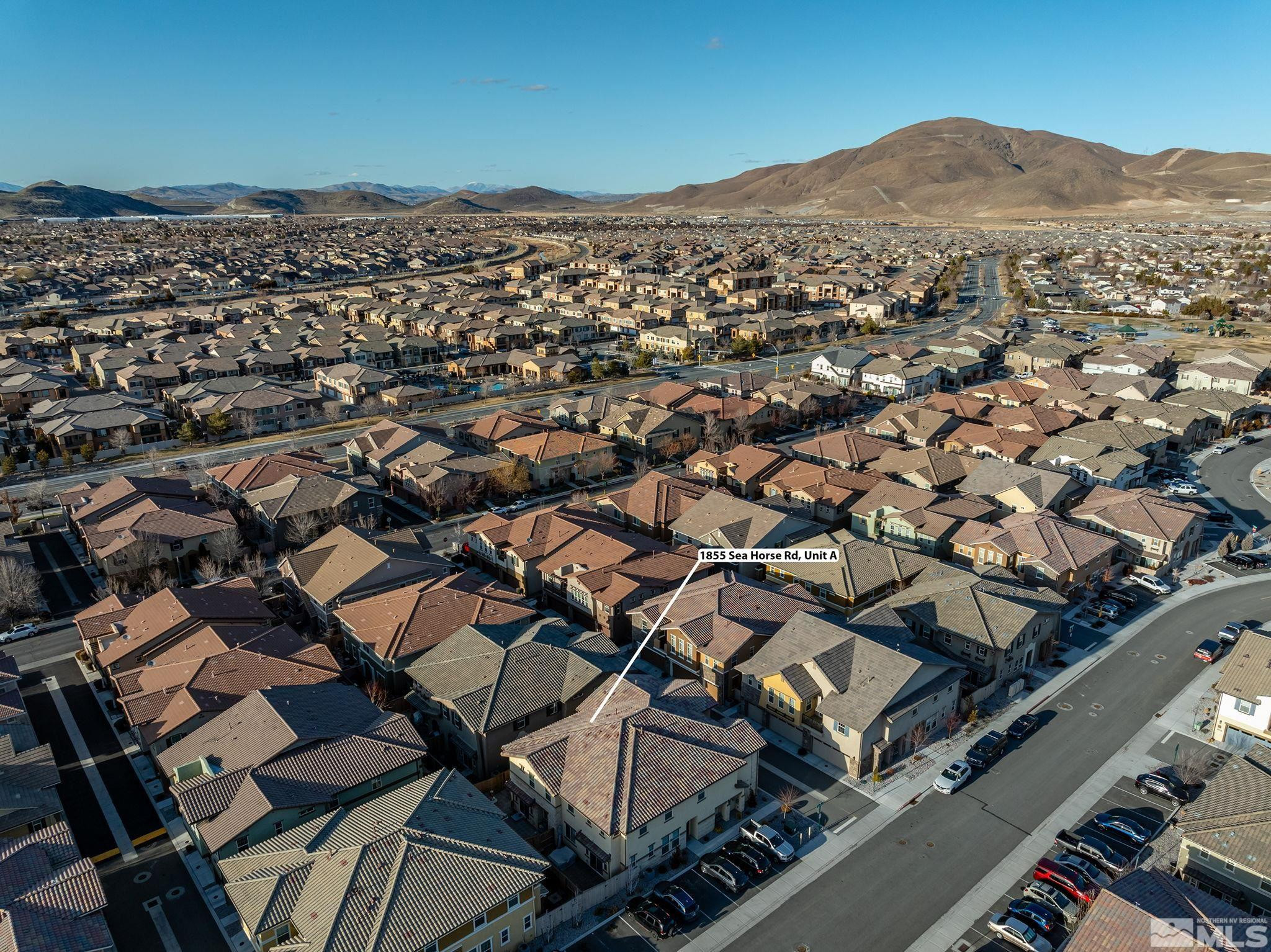 1855 Sea Horse Road, Unit A Reno, NV 89521 - Photo 28 of 32 an aerial view of residential houses with city view