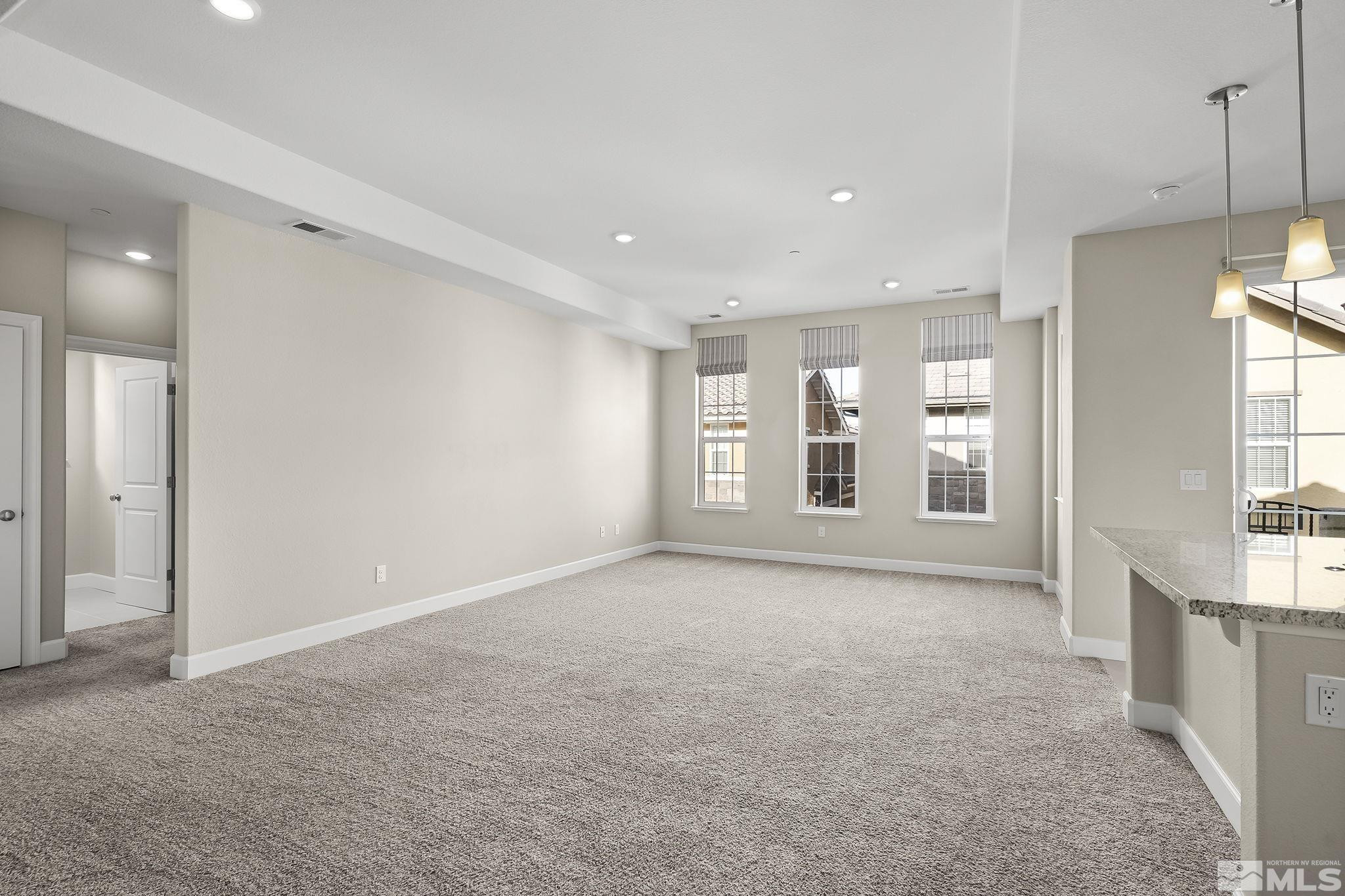 1855 Sea Horse Road, Unit A Reno, NV 89521 - Photo 3 of 32 a view of an empty room with a window