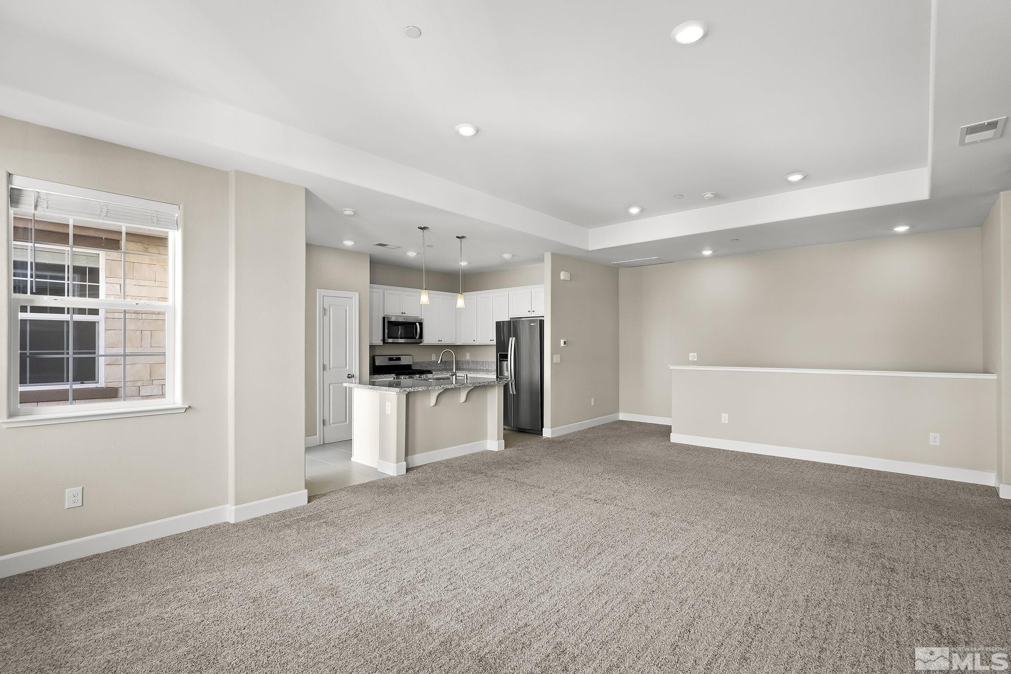 1855 Sea Horse Road, Unit A Reno, NV 89521 - Photo 5 of 32 a view of kitchen with refrigerator sink and cabinets