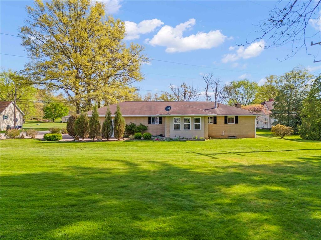 162 Ferncliff Road Rices Landing, PA 15357 - Photo 6 of 36 a view of a big house with a big yard and large trees