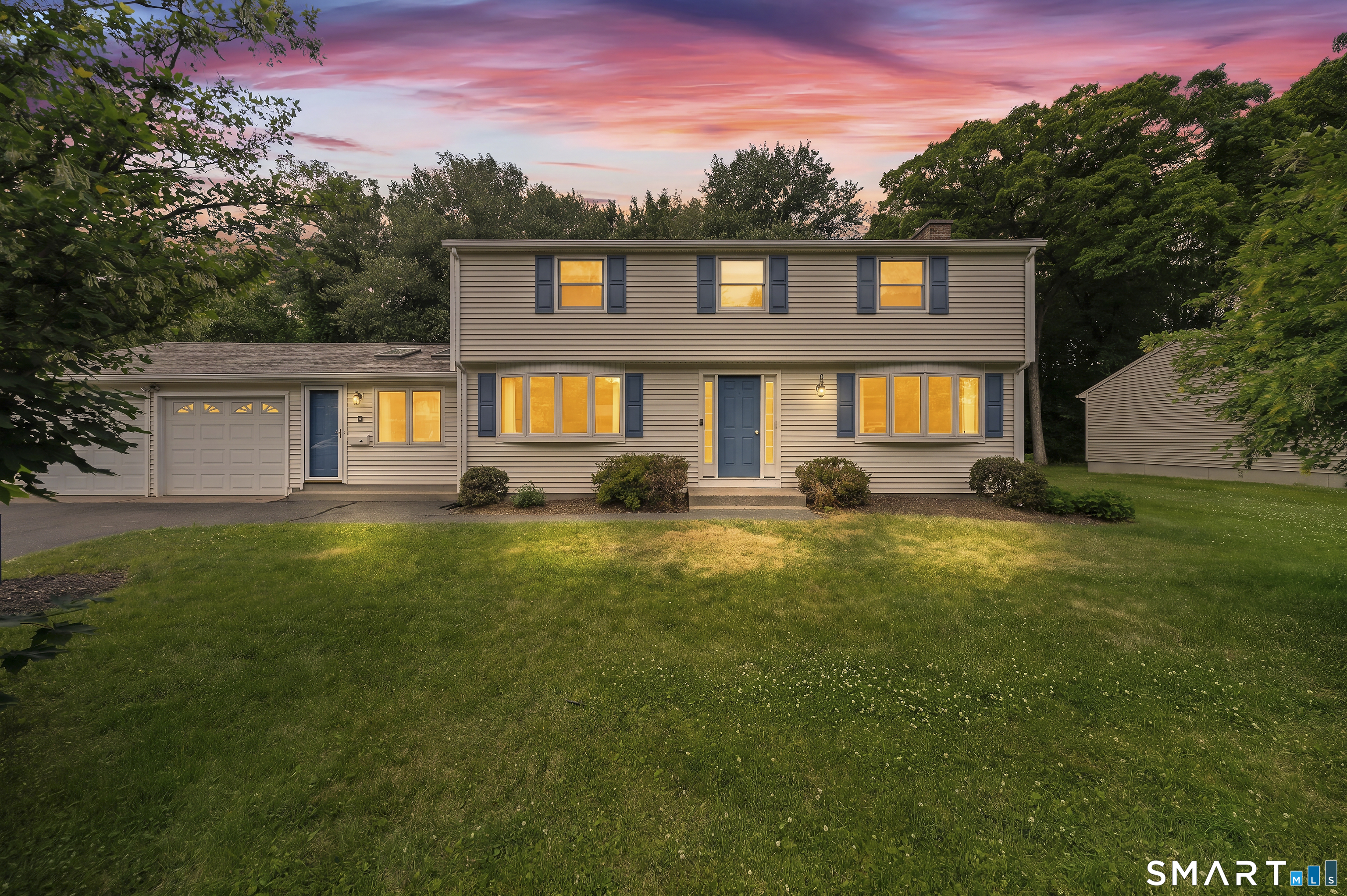 6 Cartier Road Enfield, CT 06082 - Photo 2 of 40 a front view of a house with a yard and outdoor seating