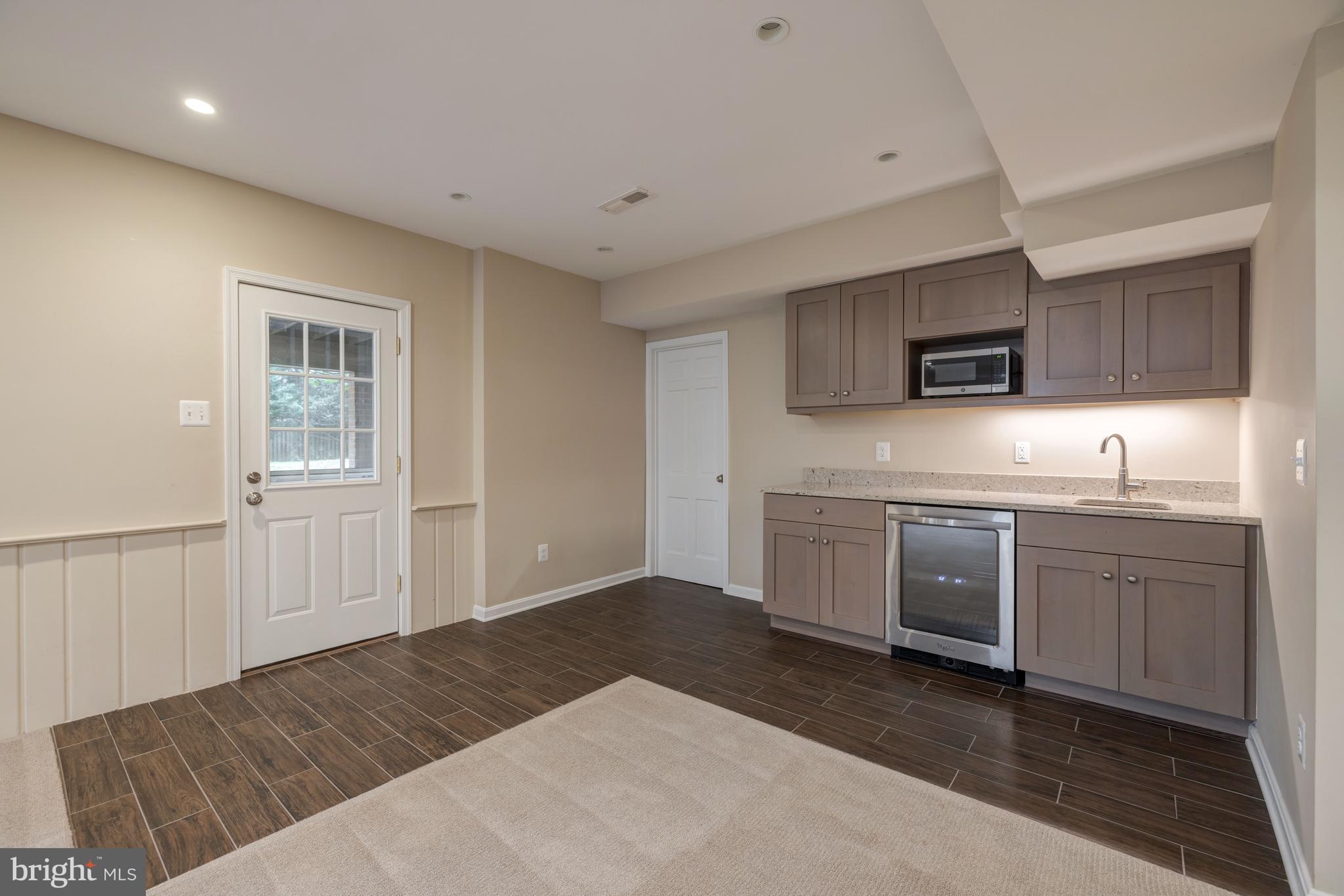 8212 Coach Street Potomac, MD 20854 - Photo 28 of 31 Walk-Out to Backyard and Wet Bar