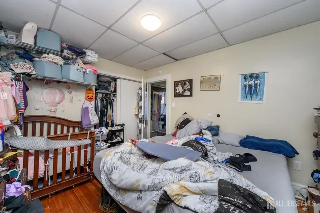 a bedroom with two beds and a bed