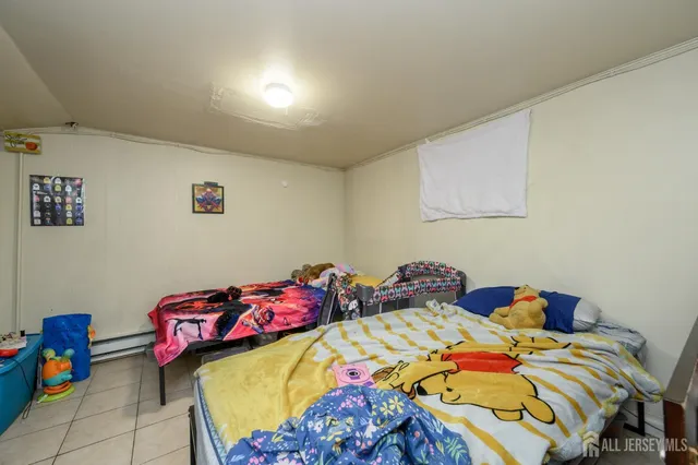 a bedroom with a bed and cabinets