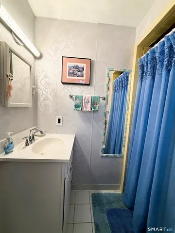 a bathroom with sink and mirror