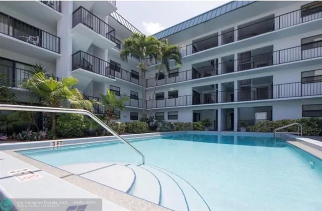 a view of a swimming pool with a patio