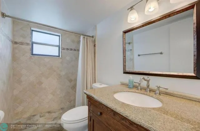 a hallway with sliding door and yard in back