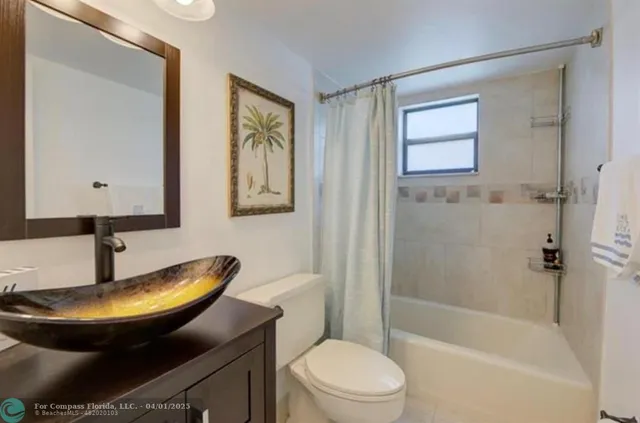 a bedroom with a bed dresser and a window