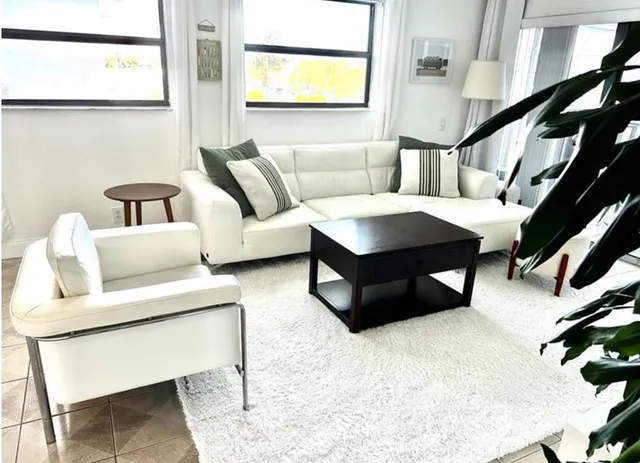 a living room with furniture and a window