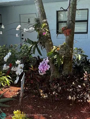 an aerial view of residential house with outdoor space and swimming pool