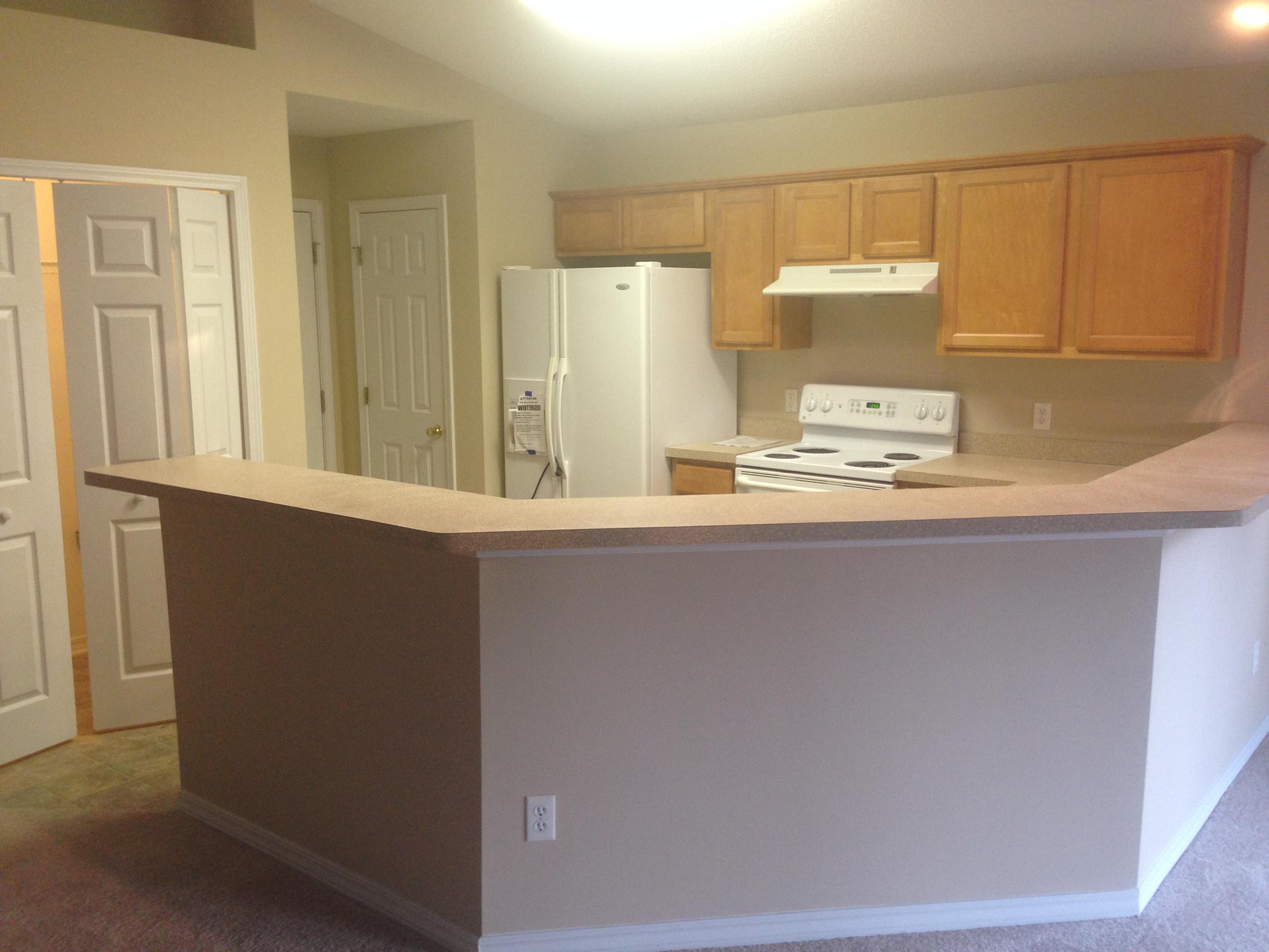 114 Sandstone Trail Crestview, FL 32539 - Photo 12 of 15 a kitchen with a sink and a stove