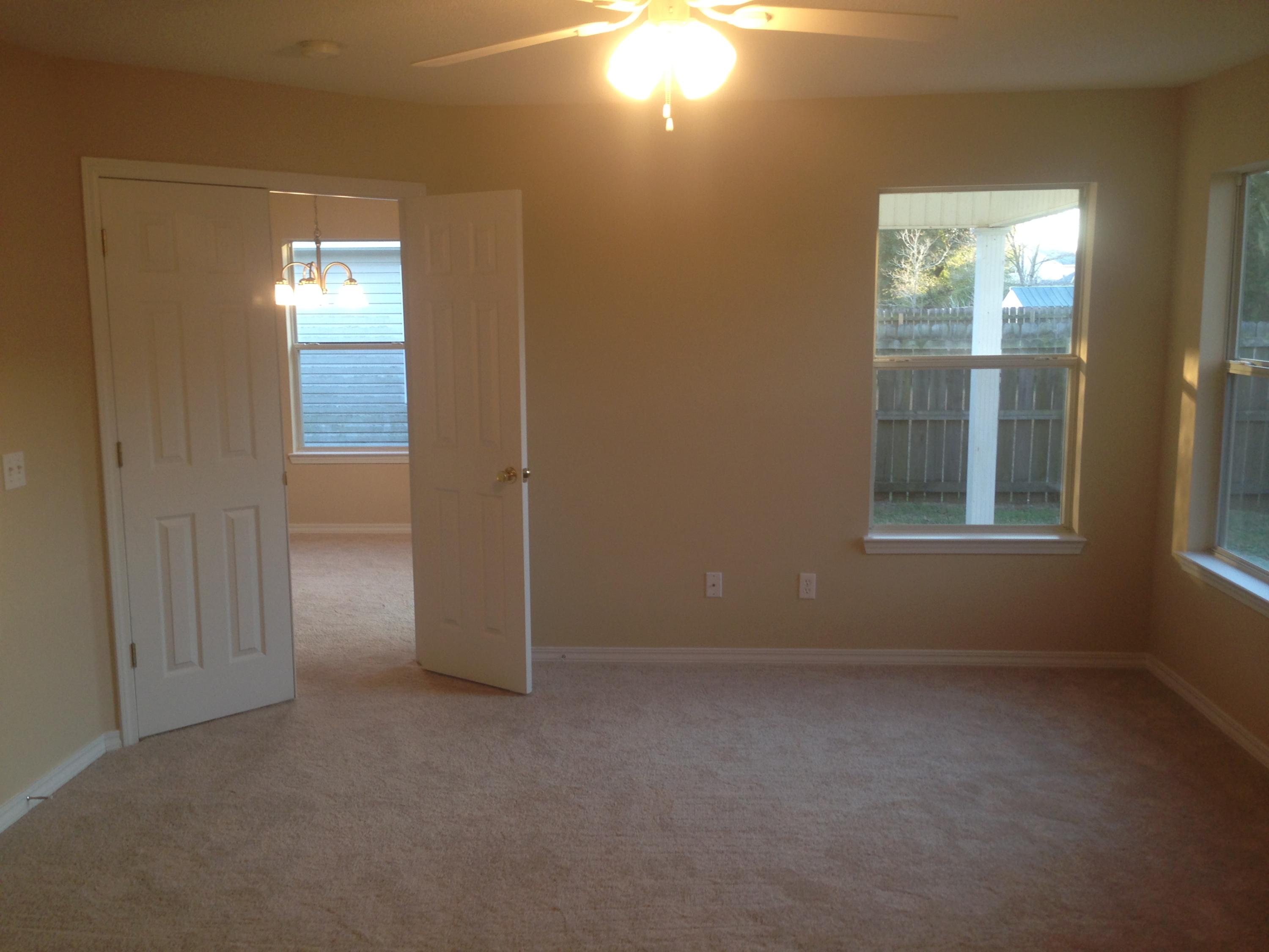 114 Sandstone Trail Crestview, FL 32539 - Photo 4 of 15 an empty room with windows and closet