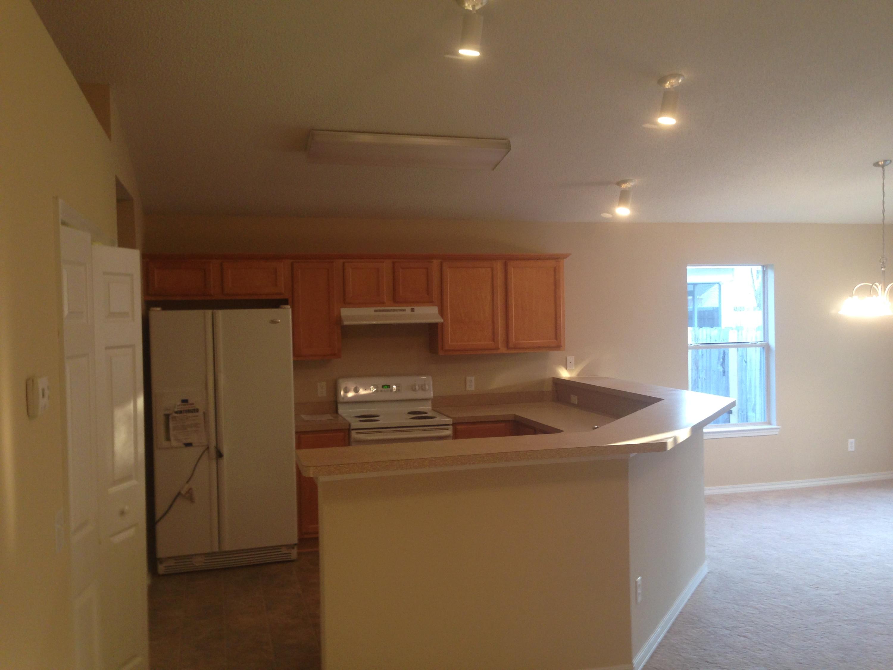 114 Sandstone Trail Crestview, FL 32539 - Photo 8 of 15 a kitchen with stainless steel appliances granite countertop a sink a stove and a refrigerator