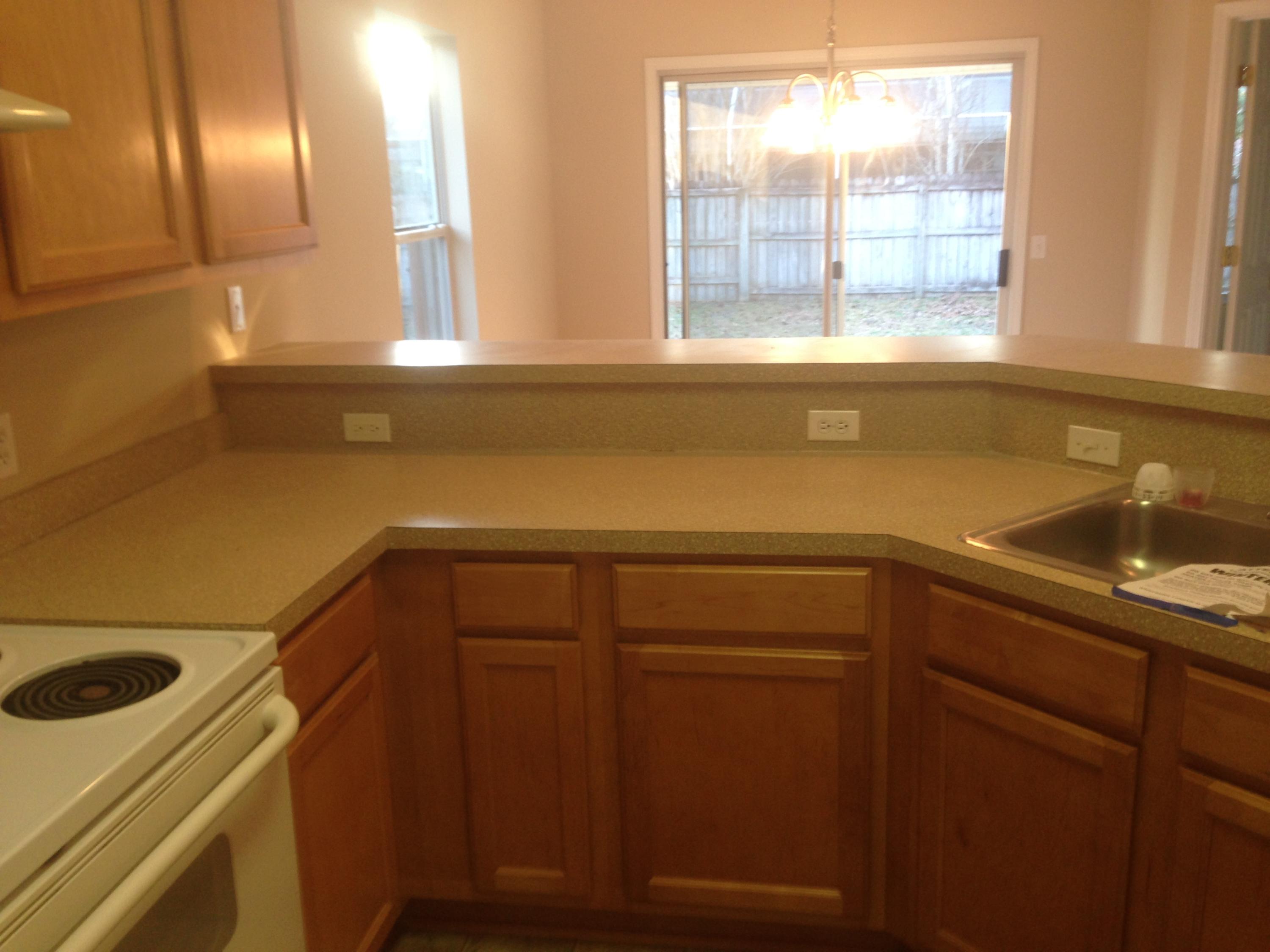 114 Sandstone Trail Crestview, FL 32539 - Photo 9 of 15 a view of a sink and dishwasher with wooden cabinet