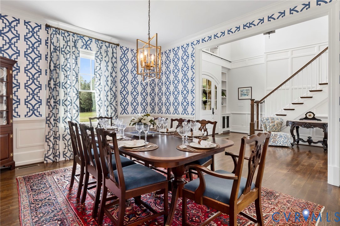 3264 Three Bridge Road Powhatan, VA 23139 - Photo 17 of 78 a view of a dining room with furniture and wooden floor