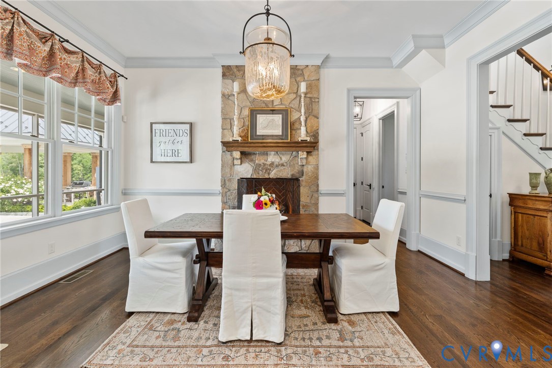 3264 Three Bridge Road Powhatan, VA 23139 - Photo 23 of 78 a view of a dining room with furniture a chandelier and wooden floor