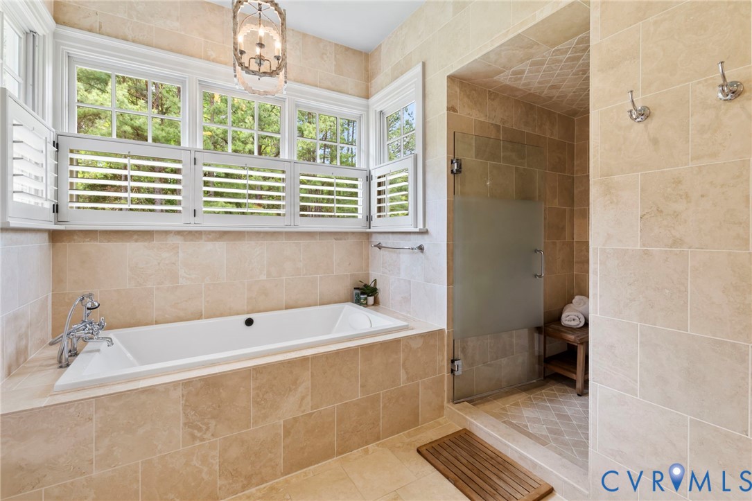 3264 Three Bridge Road Powhatan, VA 23139 - Photo 36 of 78 a bathroom with a bathtub and a window