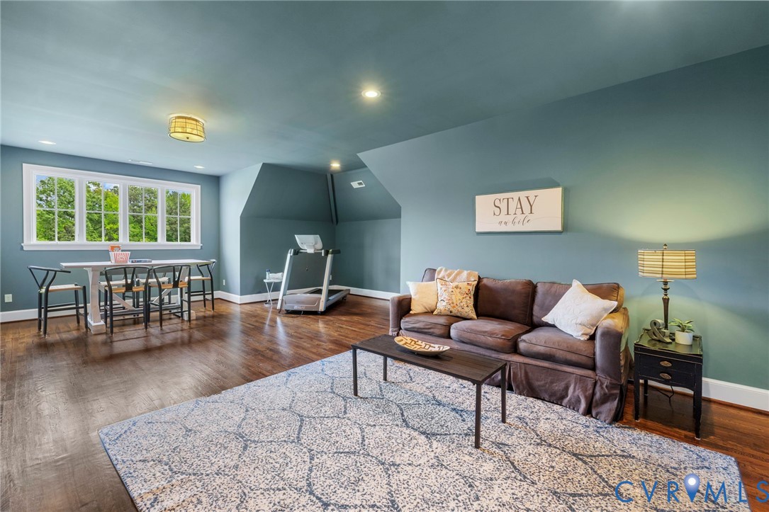 3264 Three Bridge Road Powhatan, VA 23139 - Photo 51 of 78 a living room with furniture and a wooden floor