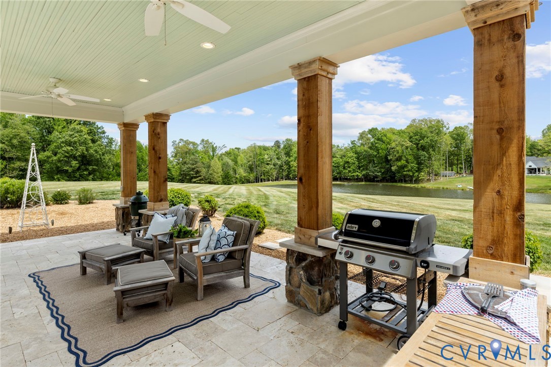 3264 Three Bridge Road Powhatan, VA 23139 - Photo 56 of 78 a living room with patio furniture and a floor to ceiling window