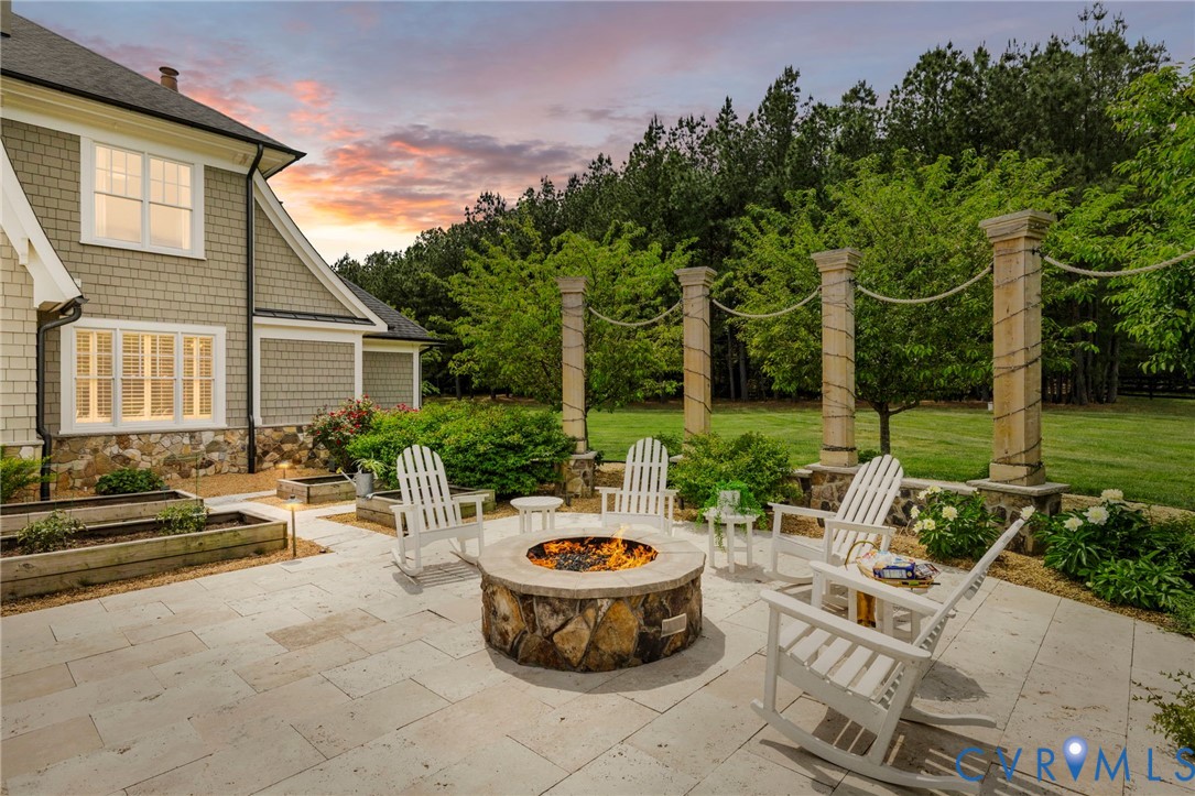3264 Three Bridge Road Powhatan, VA 23139 - Photo 61 of 78 a view of swimming pool with outdoor seating and a garden
