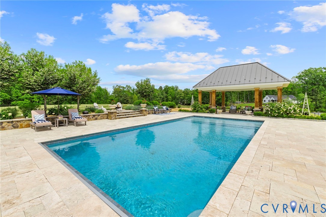 3264 Three Bridge Road Powhatan, VA 23139 - Photo 65 of 78 a swimming pool with outdoor seating and yard