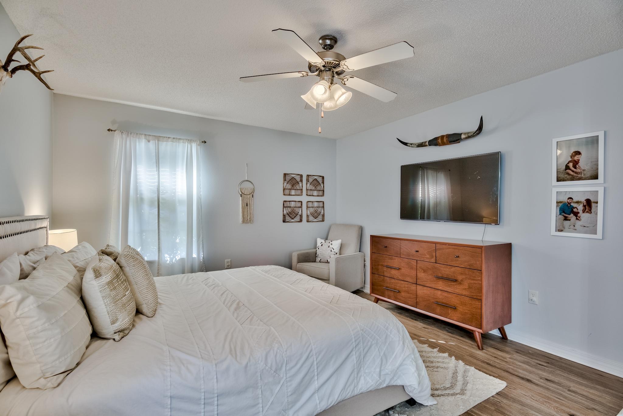14 East Poplar Way Santa Rosa Beach, FL 32459 - Photo 16 of 30 a bedroom with a large bed and a chandelier
