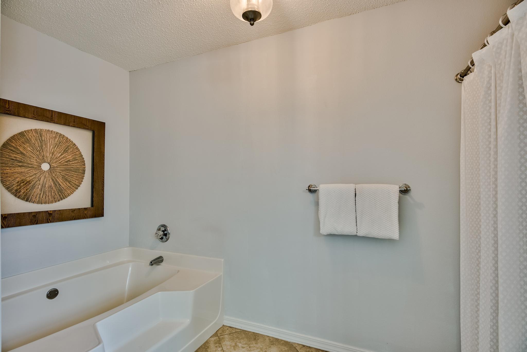 14 East Poplar Way Santa Rosa Beach, FL 32459 - Photo 18 of 30 a bathroom with a toilet tub and shower