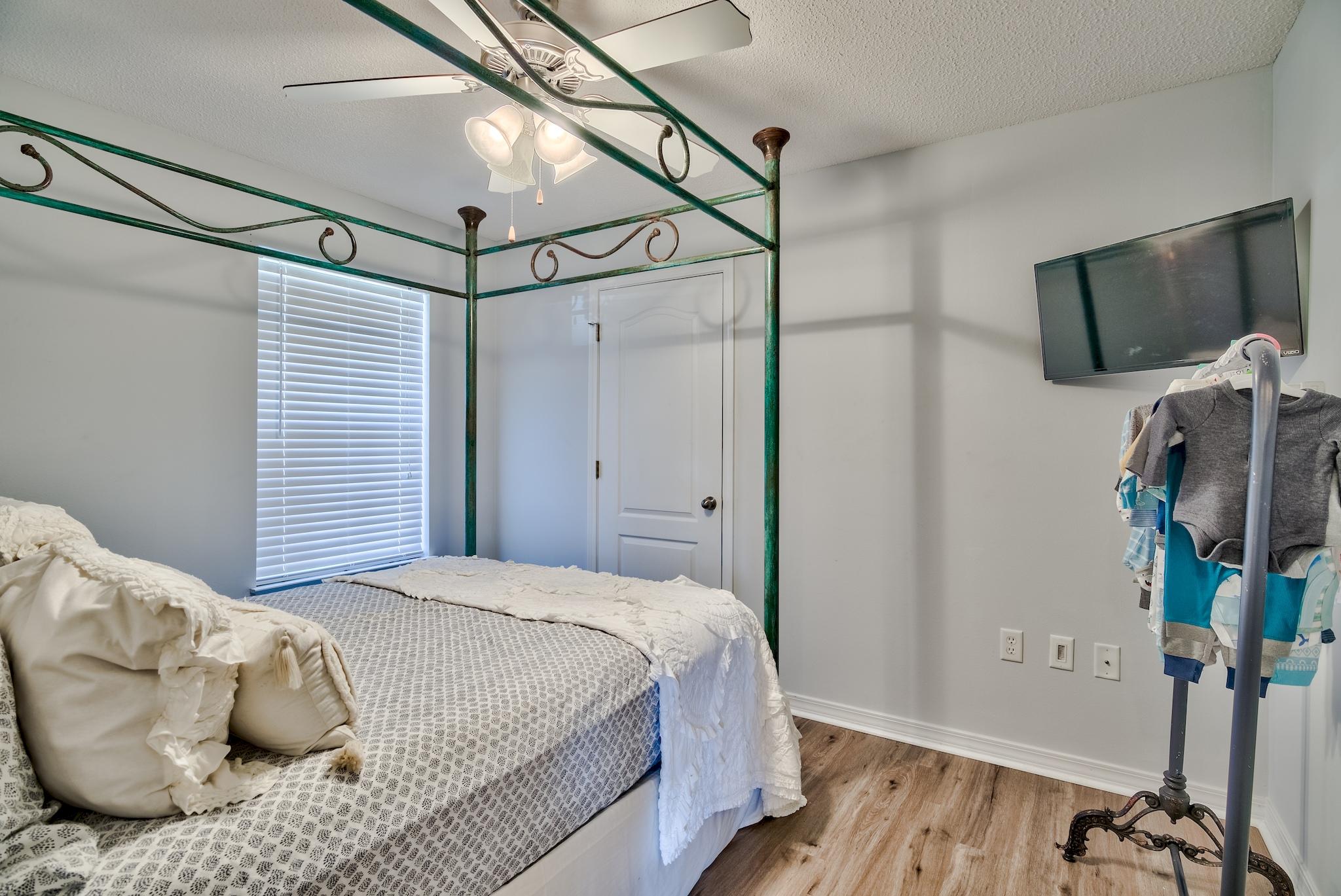 14 East Poplar Way Santa Rosa Beach, FL 32459 - Photo 19 of 30 a bedroom with a bed and a flat screen tv