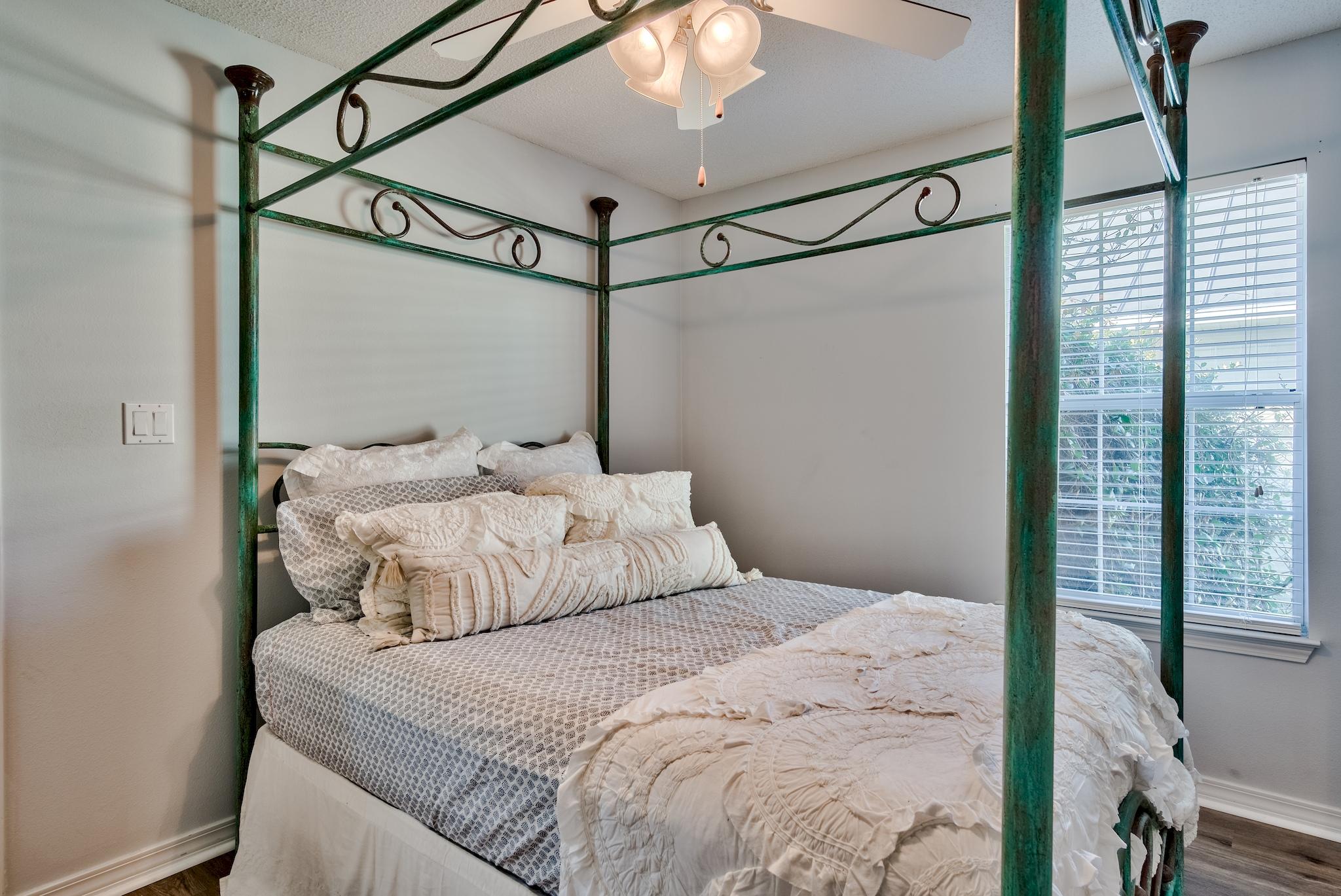 14 East Poplar Way Santa Rosa Beach, FL 32459 - Photo 20 of 30 a bedroom with a balcony a bed and a mirror