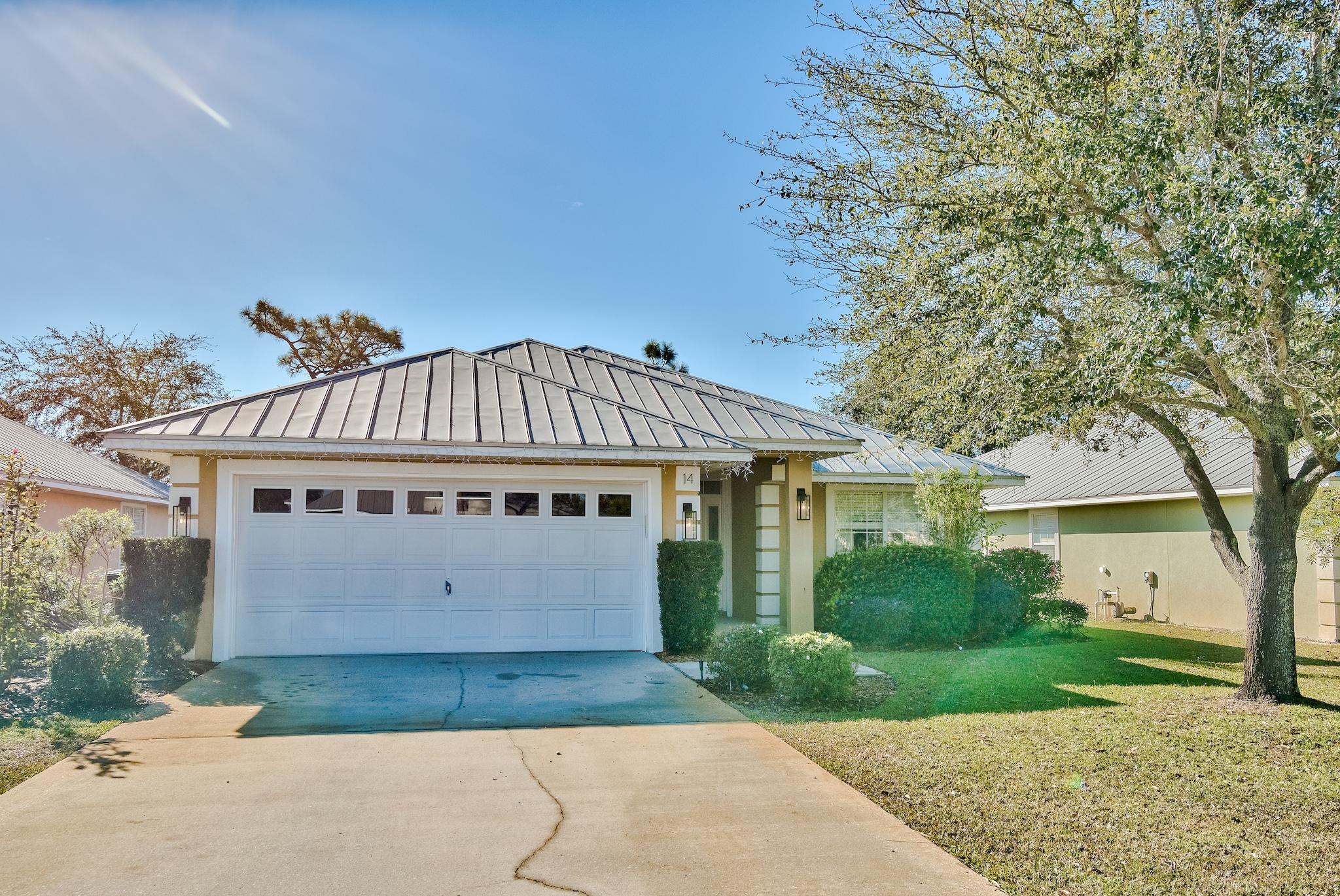 14 East Poplar Way Santa Rosa Beach, FL 32459 - Photo 2 of 30 a view of front a house with a yard and potted plants