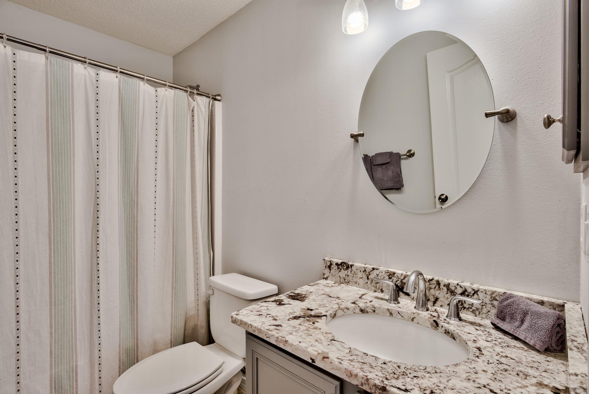 14 East Poplar Way Santa Rosa Beach, FL 32459 - Photo 21 of 30 a bathroom with a granite countertop sink and a mirror