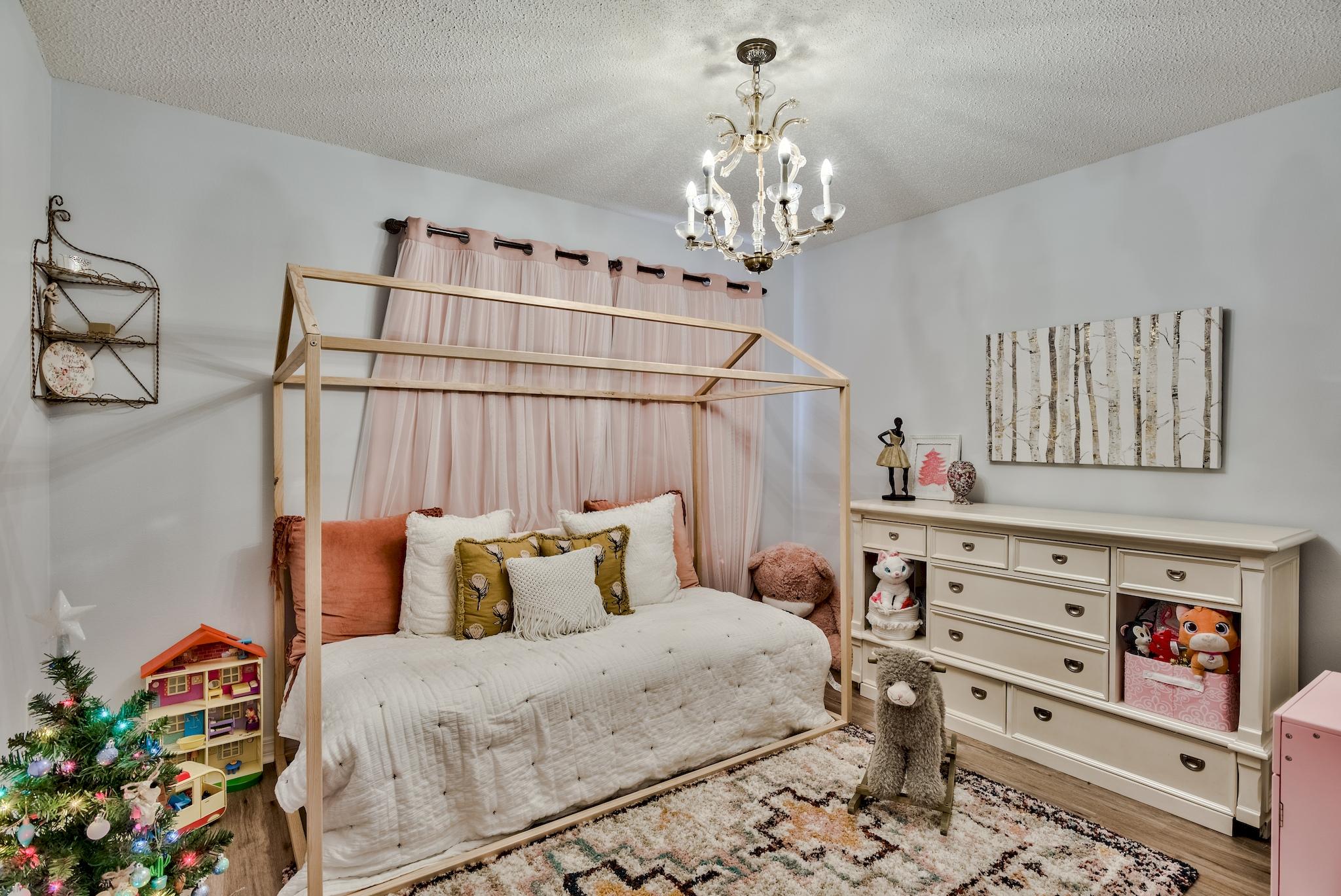 14 East Poplar Way Santa Rosa Beach, FL 32459 - Photo 22 of 30 a bedroom with a bed and a chandelier