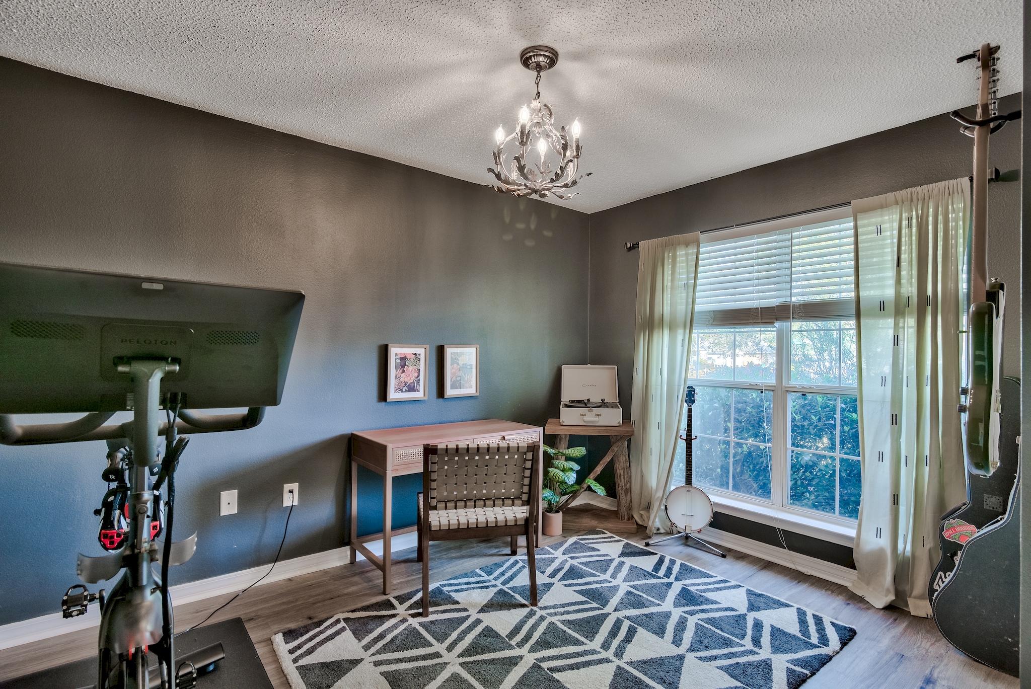 14 East Poplar Way Santa Rosa Beach, FL 32459 - Photo 24 of 30 a living room with furniture and a chandelier