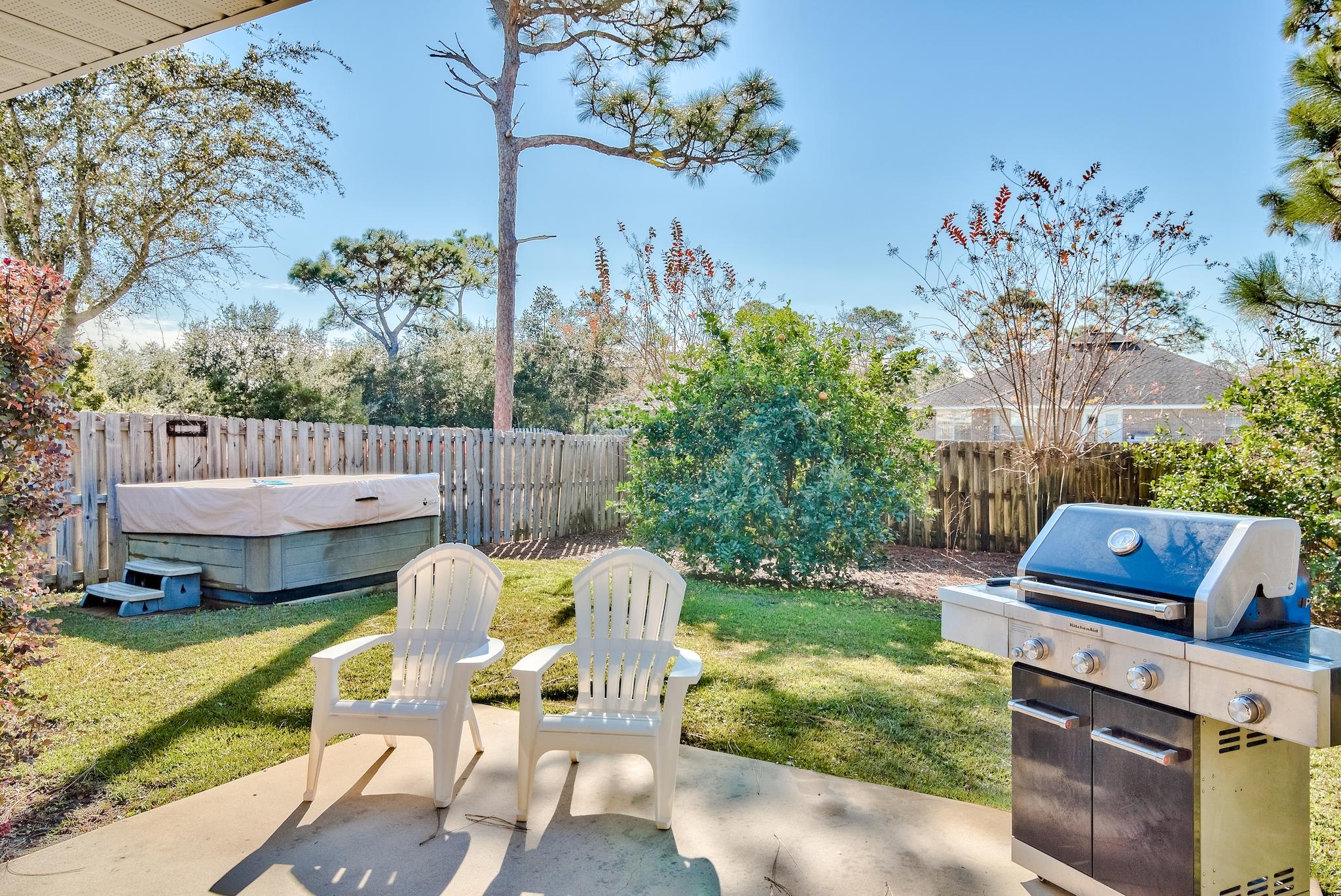14 East Poplar Way Santa Rosa Beach, FL 32459 - Photo 27 of 30 a view of a chair and table in the patio with a garden