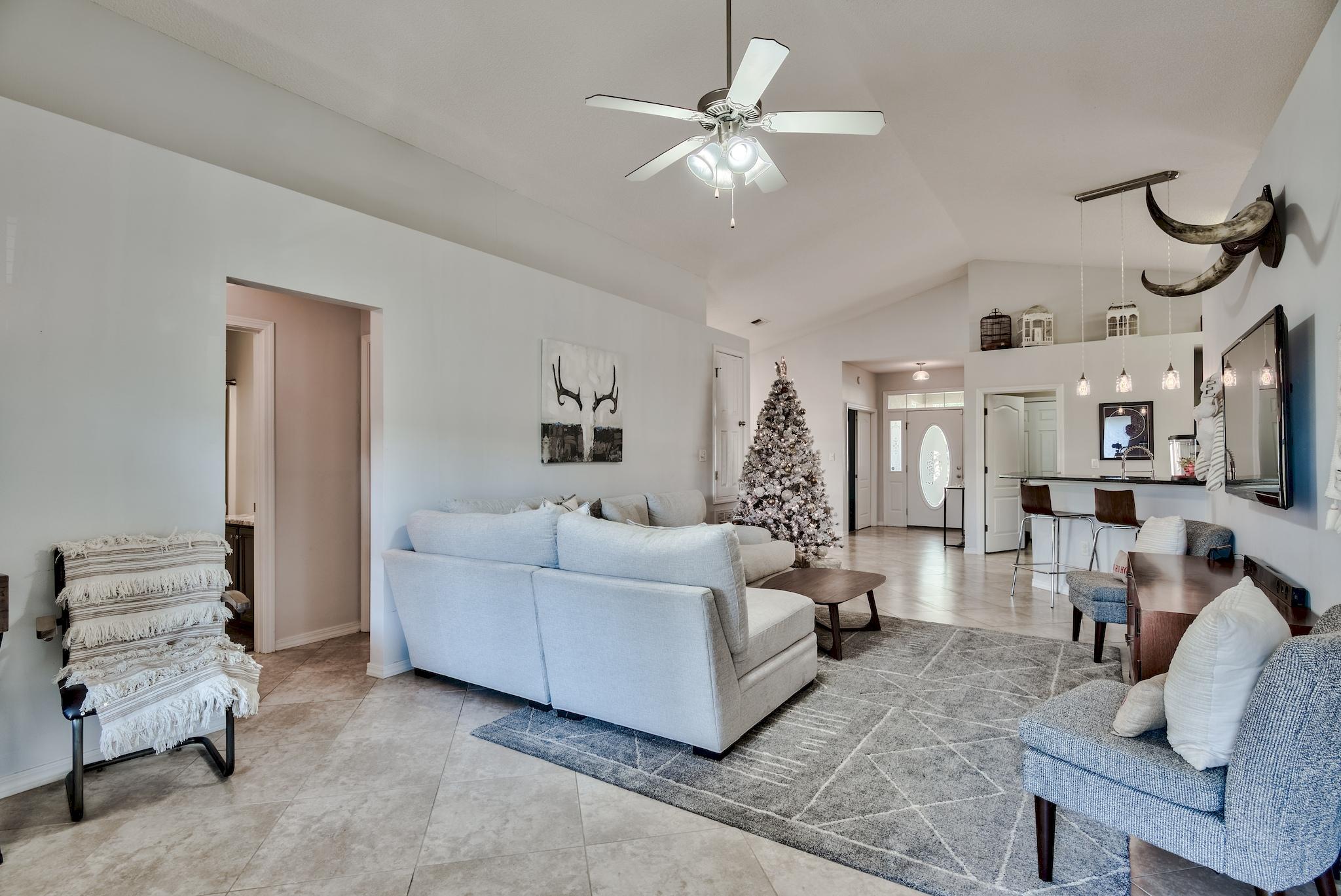 14 East Poplar Way Santa Rosa Beach, FL 32459 - Photo 4 of 30 a living room with furniture and a chandelier
