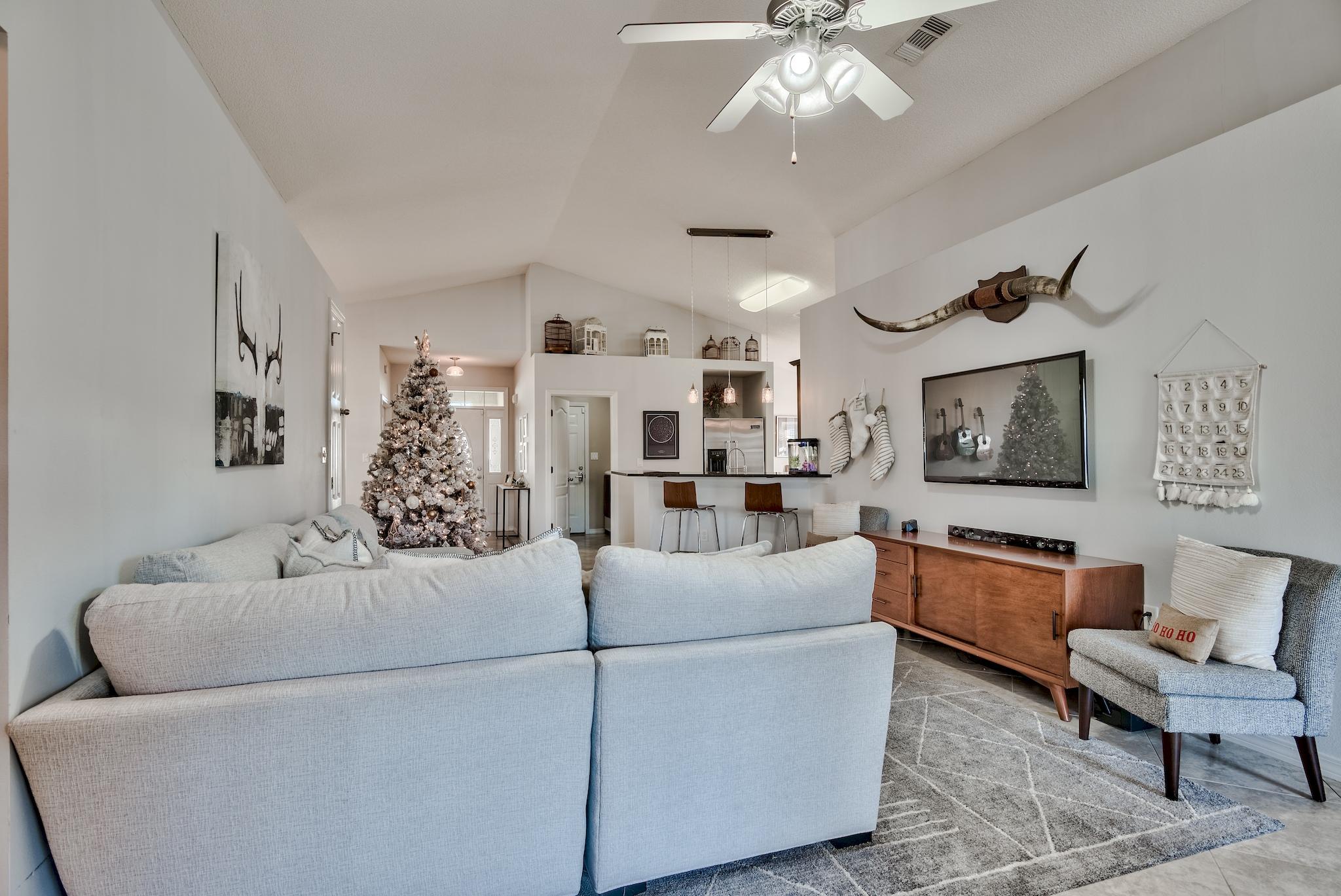 14 East Poplar Way Santa Rosa Beach, FL 32459 - Photo 5 of 30 a living room with furniture and a chandelier