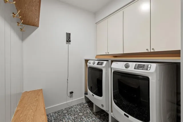 a bathroom with a sink a mirror and bathtub