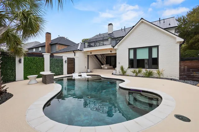 a view of balcony with a potted plant and palm trees