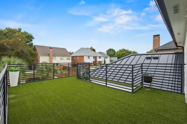 a kitchen with kitchen island a sink stove and refrigerator