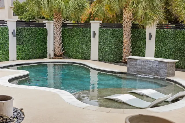 a bathroom with a sink a mirror and a shower
