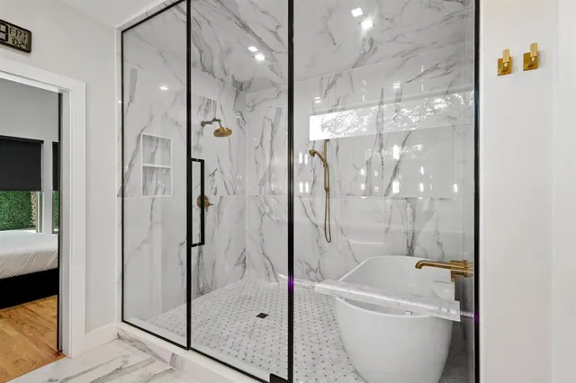 a bathroom with a shower and a sink