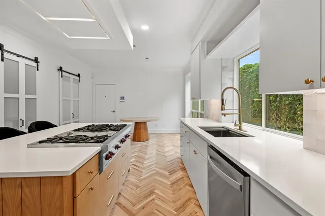 a view of a room with wooden floor and fence