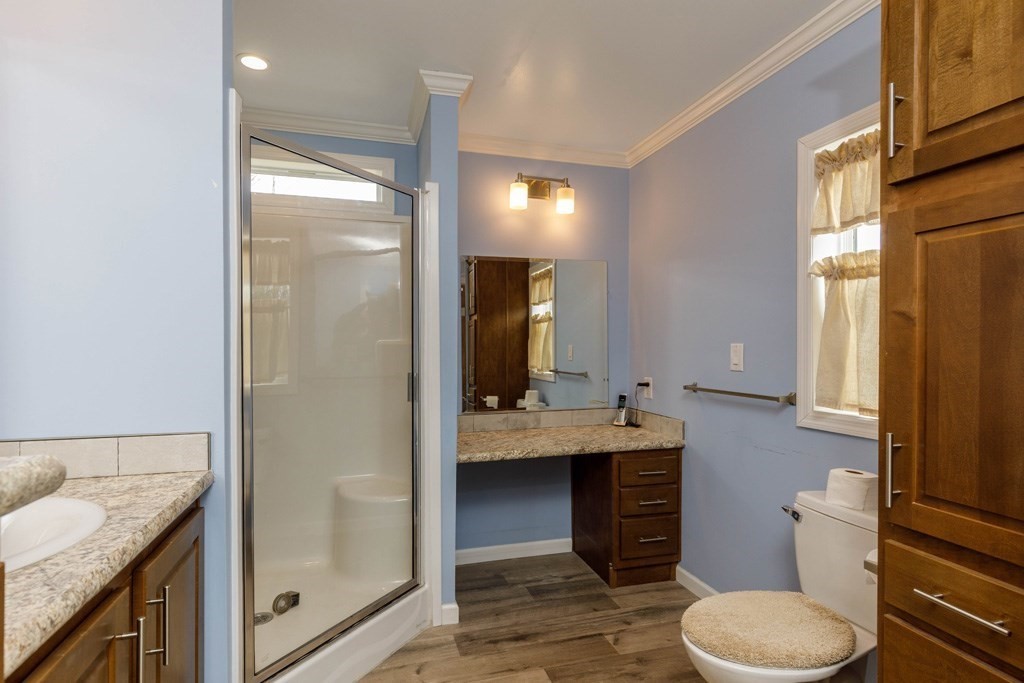 102 Topaz Terrace Gardner, MA 01440 - Photo 11 of 20 a bathroom with a granite countertop sink toilet and shower