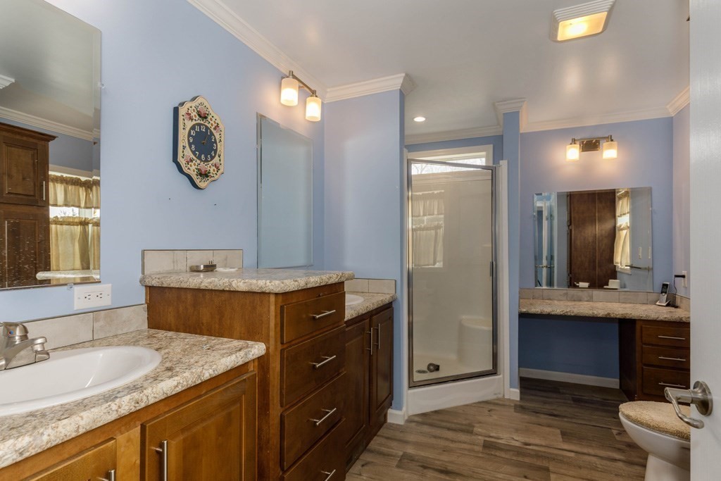 102 Topaz Terrace Gardner, MA 01440 - Photo 10 of 20 a bathroom with a granite countertop sink a mirror and a shower