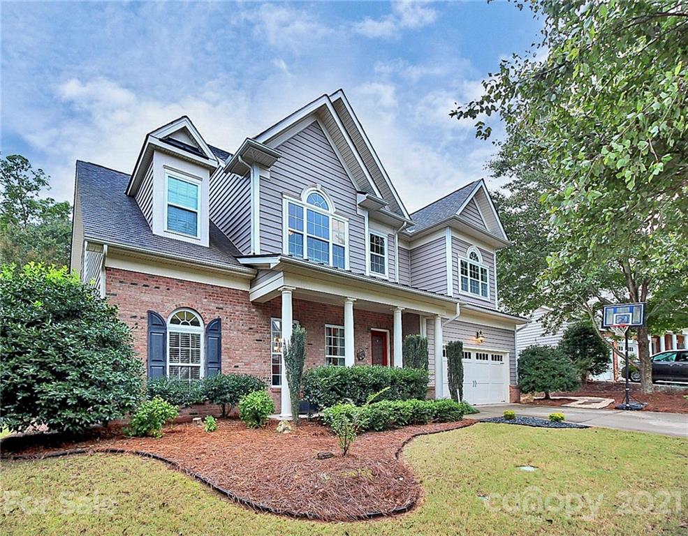 1339 Secret Path Drive Fort Mill, SC 29708 - Photo 2 of 46 a front view of a house with a yard and trees
