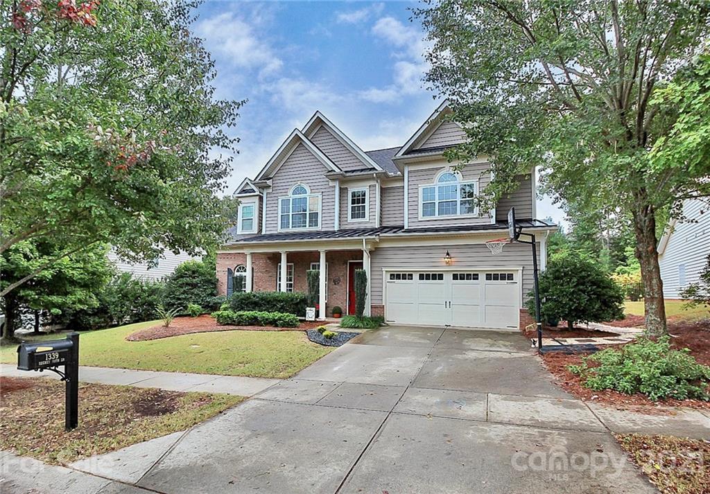 1339 Secret Path Drive Fort Mill, SC 29708 - Photo 3 of 46 a front view of a house with a yard and trees