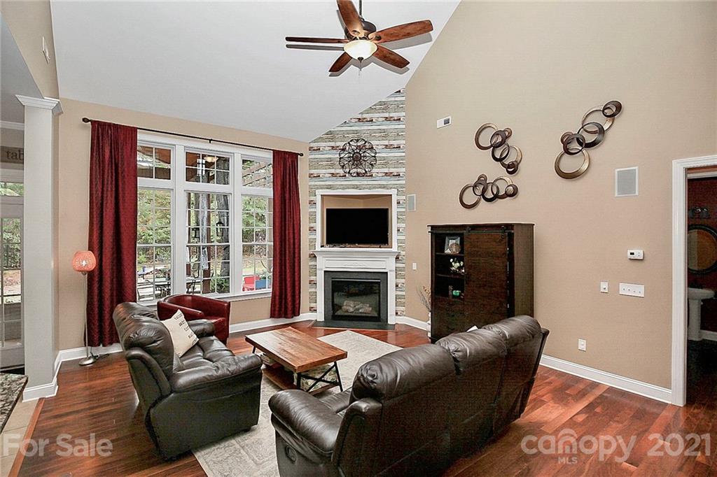 1339 Secret Path Drive Fort Mill, SC 29708 - Photo 23 of 46 a living room with furniture a flat screen tv and a fireplace