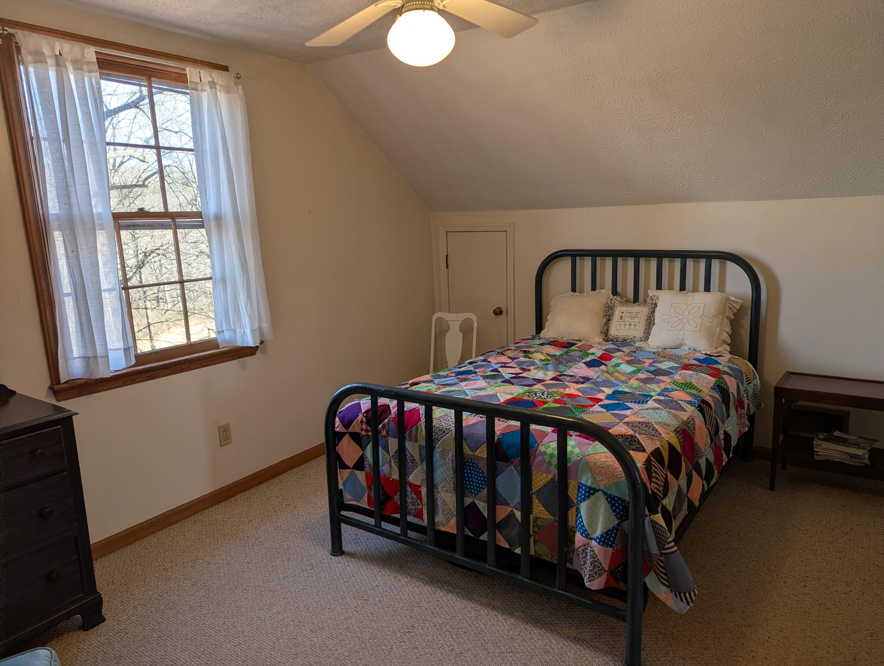 1115 Robin Ridge Road Henry, VA 24102 - Photo 11 of 59 a bed sitting in a bedroom next to a window