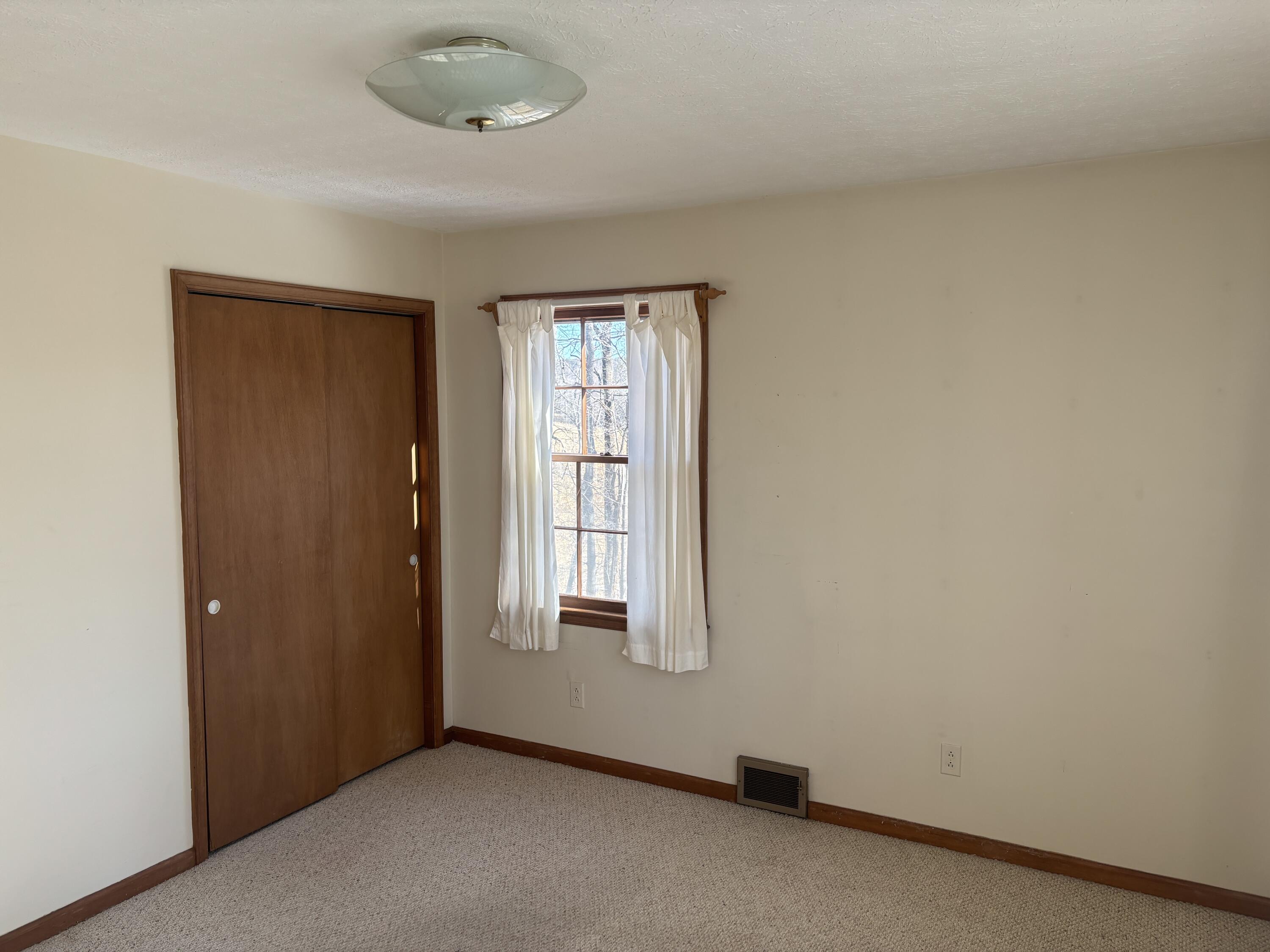 1115 Robin Ridge Road Henry, VA 24102 - Photo 15 of 30 an empty room with windows and closet